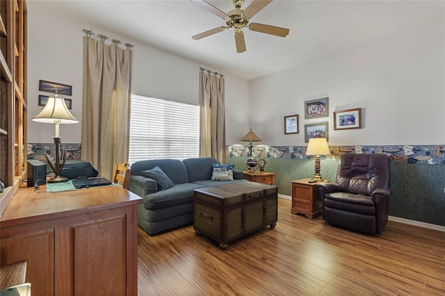 living room with hardwood / wood-style flooring and ceiling fan