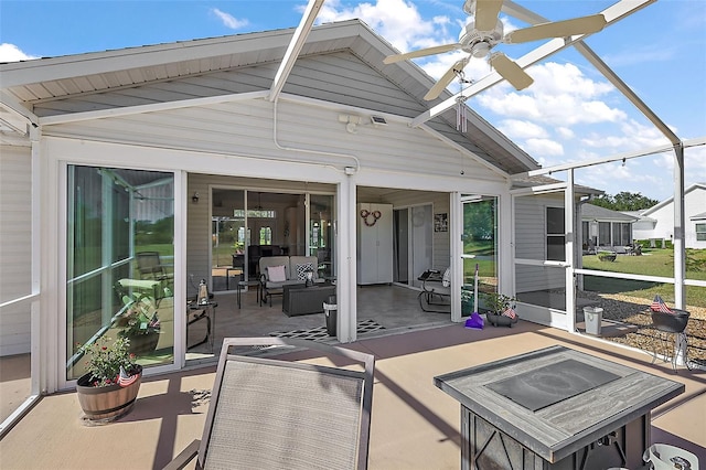 sunroom / solarium with vaulted ceiling with beams and ceiling fan