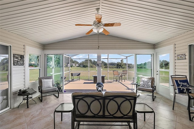 sunroom featuring vaulted ceiling and ceiling fan