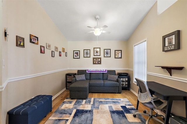 office featuring light wood-type flooring, ceiling fan, and lofted ceiling