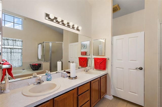 bathroom with tile patterned flooring, vanity, and independent shower and bath