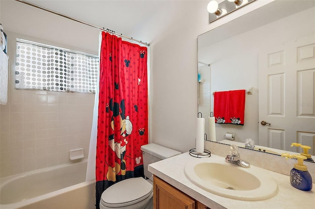 full bathroom with vanity, toilet, and shower / tub combo