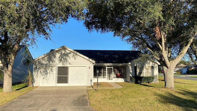 ranch-style home with a front yard and a garage