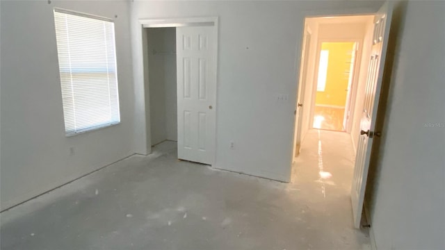 unfurnished bedroom with a closet