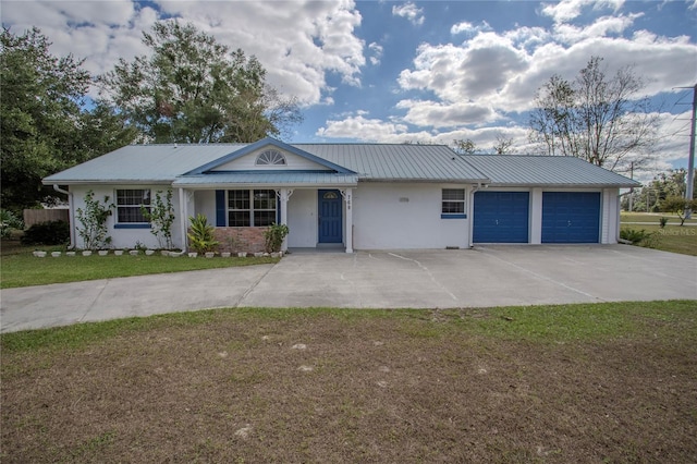 ranch-style home with a garage and a front lawn