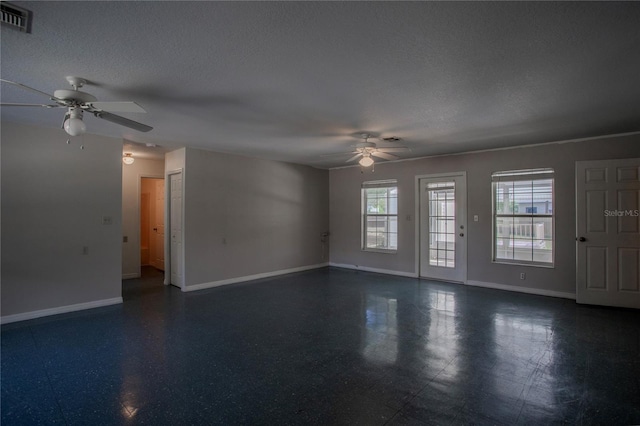 empty room featuring a textured ceiling and ceiling fan