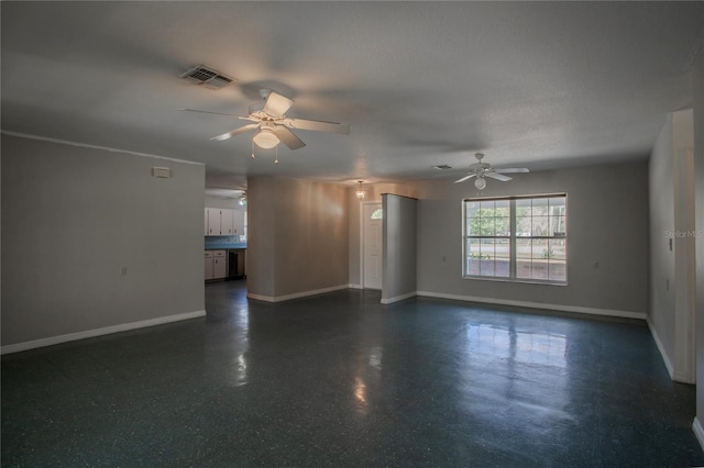 unfurnished room featuring a textured ceiling and ceiling fan