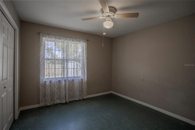 unfurnished room with ceiling fan