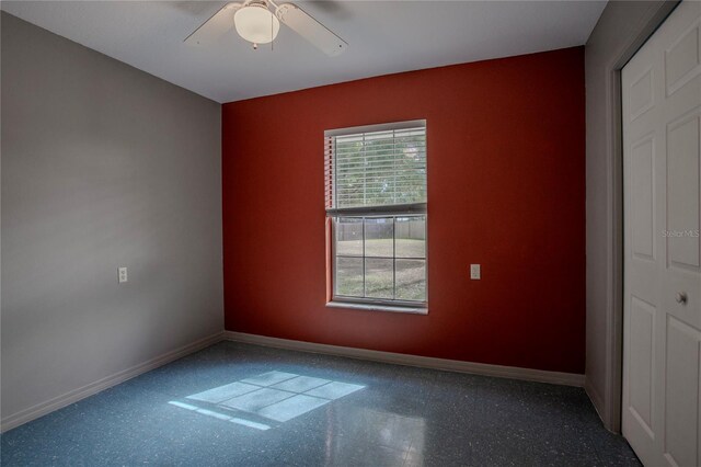 unfurnished room with ceiling fan