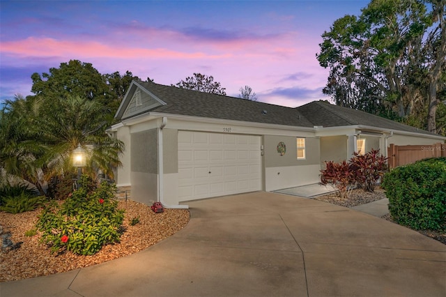 single story home featuring a garage