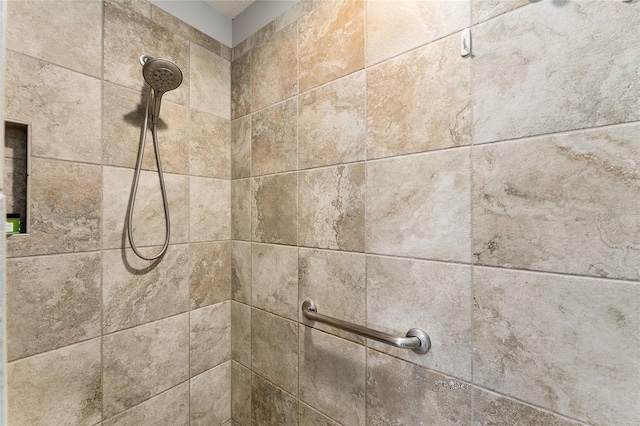 details with a tile shower