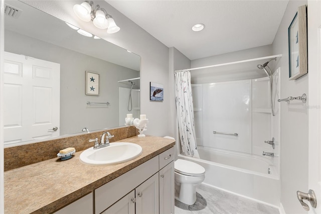 full bathroom featuring shower / bath combo with shower curtain, vanity, and toilet