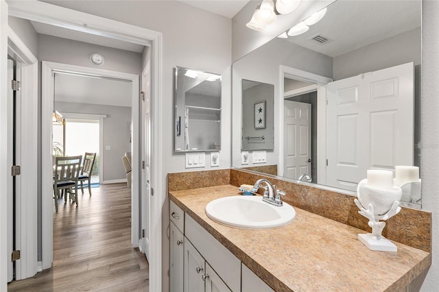 bathroom featuring hardwood / wood-style floors and vanity