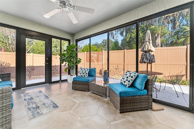 sunroom / solarium with ceiling fan