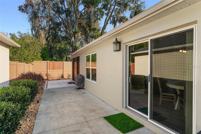 view of side of property featuring a patio