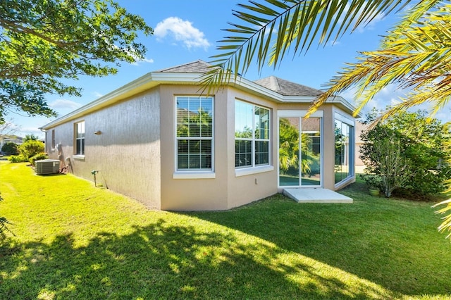 view of home's exterior with a yard