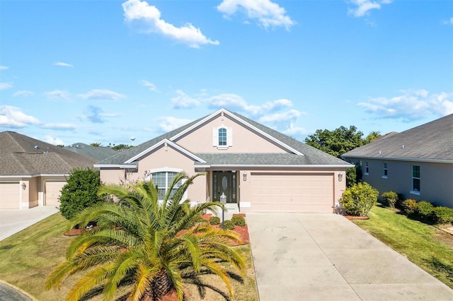 view of front of home featuring a front lawn and a garage