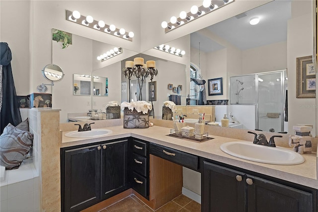 bathroom featuring tile patterned floors, vanity, and an enclosed shower