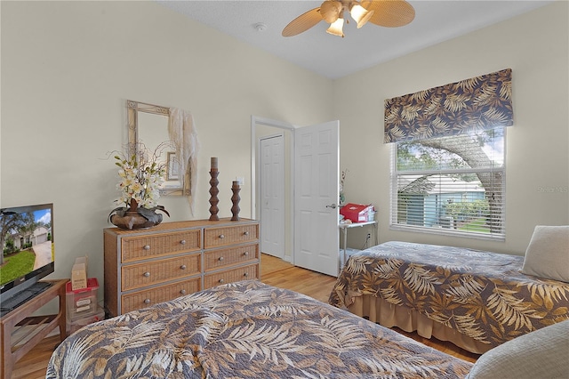 bedroom featuring ceiling fan and light hardwood / wood-style flooring