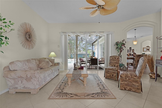 tiled living room featuring ceiling fan