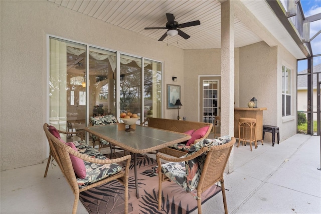 view of patio / terrace with a lanai and ceiling fan