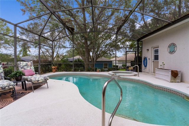 view of pool with a patio area, a lanai, and an in ground hot tub