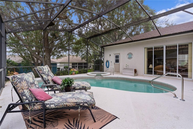 view of swimming pool with an in ground hot tub, a patio, and a lanai