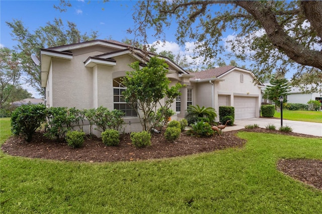 view of front of house featuring a garage and a front lawn