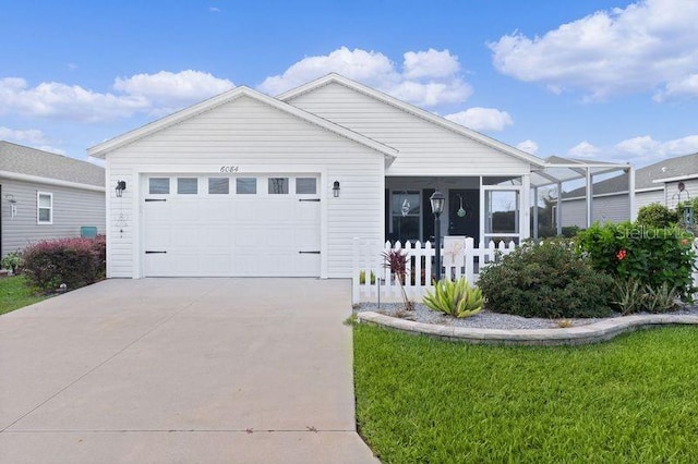 single story home featuring a front yard and a garage