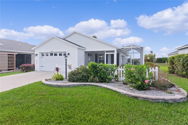 view of front of property featuring a front lawn and a garage