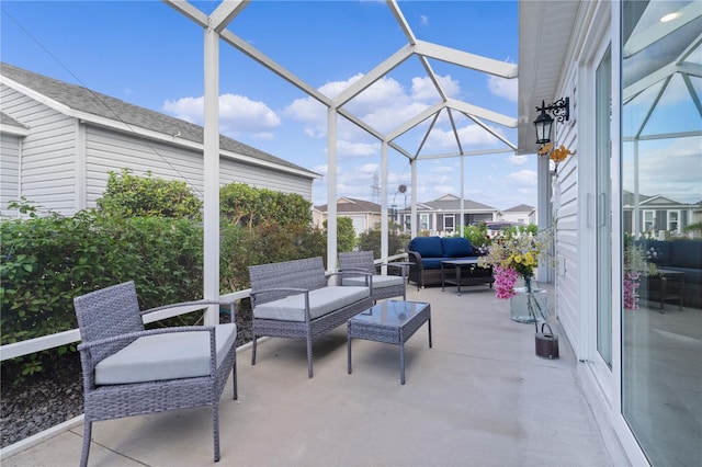 view of patio / terrace with an outdoor living space and a lanai