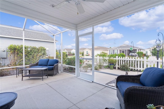 sunroom / solarium featuring wooden ceiling, ceiling fan, and a healthy amount of sunlight