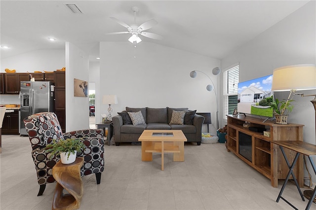 living room with ceiling fan and lofted ceiling