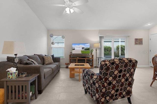 living room with light tile patterned floors, vaulted ceiling, and ceiling fan