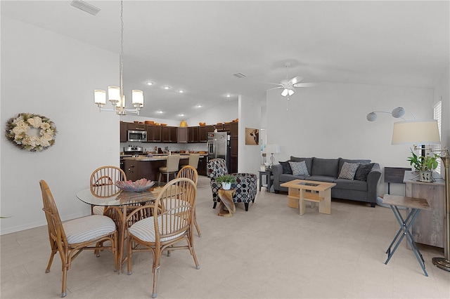 dining area with ceiling fan with notable chandelier and lofted ceiling