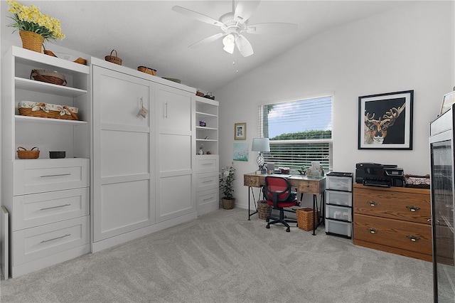 office space with ceiling fan, light colored carpet, and vaulted ceiling