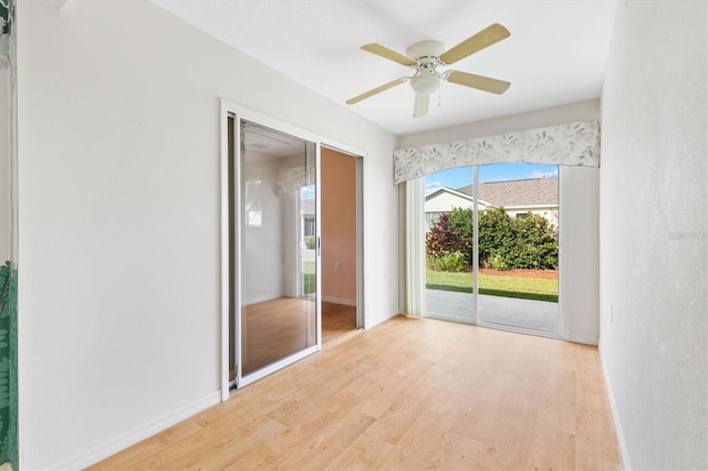 interior space with light hardwood / wood-style flooring and ceiling fan