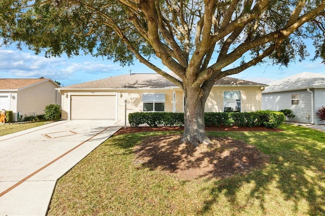 single story home with a front yard and a garage