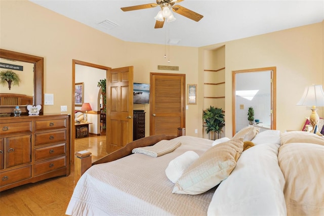 bedroom featuring light wood-type flooring and ceiling fan