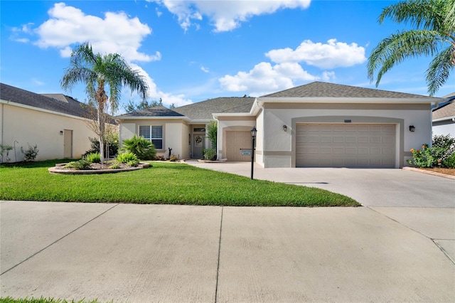 view of front of property with a front lawn and a garage