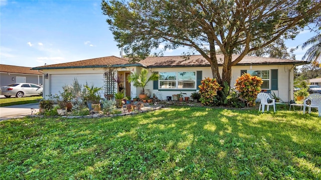 ranch-style house with a front lawn and a garage