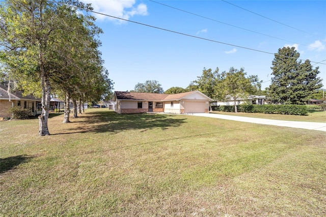 ranch-style home with a front yard and a garage