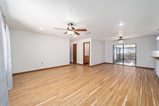 empty room with light hardwood / wood-style flooring and ceiling fan