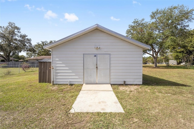 view of outdoor structure with a lawn