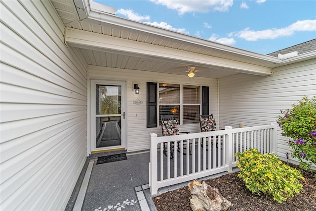 entrance to property with ceiling fan