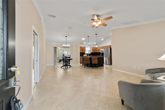 living area featuring crown molding, visible vents, light tile patterned flooring, baseboards, and ceiling fan with notable chandelier