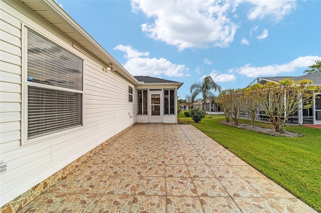 exterior space with a patio and a sunroom