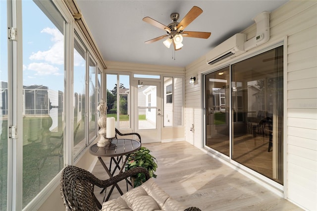 sunroom / solarium with an AC wall unit and ceiling fan