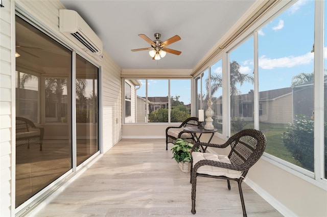 sunroom / solarium with a wall unit AC and a ceiling fan