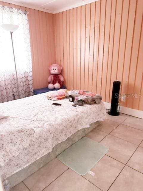 unfurnished bedroom featuring light tile patterned flooring